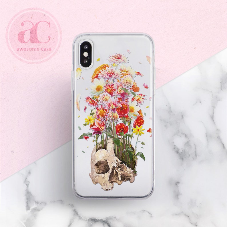 May include: A clear phone case with a skull design. The skull is filled with colorful flowers, including red, pink, yellow, and white.