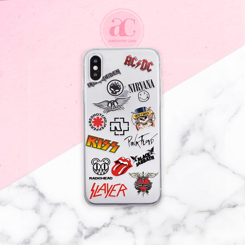 May include: A clear phone case with various band logos and names, including AC/DC, Nirvana, Pink Floyd, Kiss, Slayer, and Radiohead.