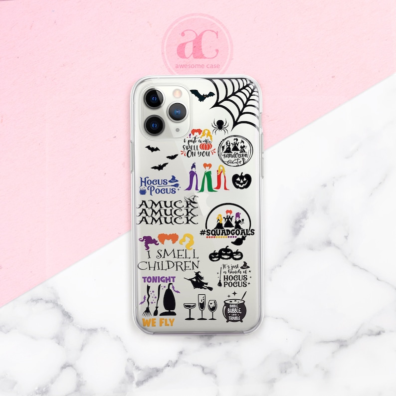 May include: A clear phone case with a black and white Hocus Pocus design. The case features the Sanderson sisters, a spider web, bats, pumpkins, and the text "I put a spell on you", "Hocus Pocus", "Amuck", "I smell children", "Tonight", "We fly", "#SquadGoals", and "It's just a bunch of Hocus Pocus".