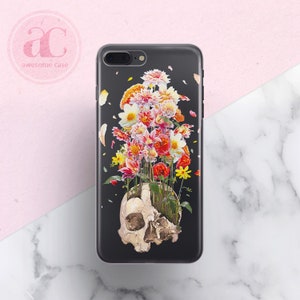 May include: A black phone case with a white skull and colorful flowers growing out of the top of the skull.