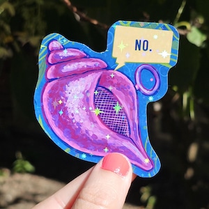 May include: A sticker featuring a purple seashell with a grid pattern, outlined in blue. A speech bubble with the word "NO." is above the shell. The sticker has a holographic, glittery effect.