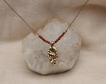Small hand pendant red sunstone pure golden brass healing stone somatic jewelry for body workers and artists
