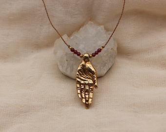Hand pendant pink garnet pure golden brass healing stone somatic jewelry for body workers and artists
