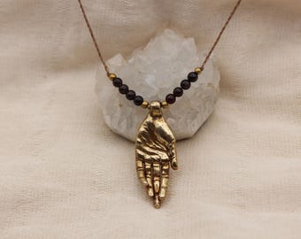 Hand pendant red garnet pure golden brass healing stone somatic jewelry for body workers and artists