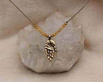 Small hand pendant yellow jade pure golden brass healing stone somatic jewelry for body workers and artists