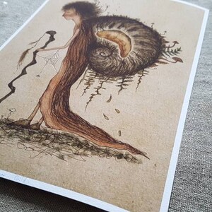 May include: A whimsical illustration of a figure with a long, flowing dress and a large shell on their back. The figure is holding a long, thin stick and is walking through a forest. The illustration is done in brown and black ink on a beige background.