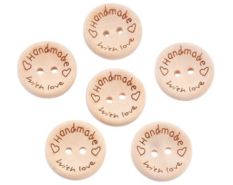 May include: Six wooden buttons with two holes each. The buttons are light brown and have the words "Handmade with love" engraved on them.