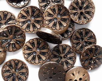 May include: A collection of round, bronze-colored buttons featuring a raised, petal-like floral pattern with dark recessed detailing. Each button has two central holes for attachment, with a smooth, metallic finish and a consistent circular shape.