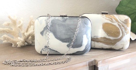 silver hard clutch bag