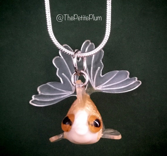 Fish charm hotsell necklace