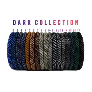 May include: A collection of 17 beaded bracelets in various dark colors, including blue, brown, gray, and black. The text "DARK COLLECTION" is displayed above the bracelets, with numbers 1-17 below.