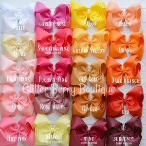 May include: A chart of 16 different colors of grosgrain ribbon bows. The colors are: white, garden rose, yellow, peach, ivory, shocking pink, golden yellow, orange, light pink, fuchsia pink, old gold, dark orange, pink, rose mauve, ginger, red, hot pink, maize, wine, and burgundy.