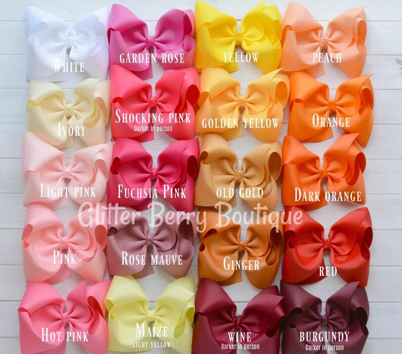 May include: A chart of 16 different colors of grosgrain ribbon bows. The colors are: white, garden rose, yellow, peach, ivory, shocking pink, golden yellow, orange, light pink, fuchsia pink, old gold, dark orange, pink, rose mauve, ginger, red, hot pink, maize, wine, and burgundy.