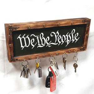14.75" Key Holders "We The People" Wooden Key holder, 5 hooks to hang keys, Handcrafted wooden sign, hand painted sign, Border with bullets