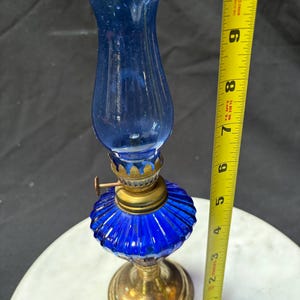 Vintage cobalt blue oil lamp, miniature kerosene lamp, brass burner blue shade, pedestal lamp 10”x3” gold tone