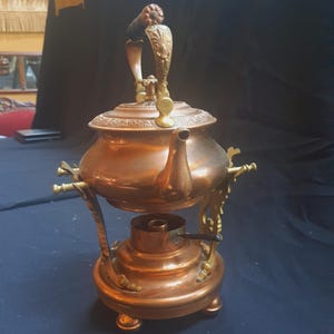 May include: A set of three ceramic nesting bowls in shades of blue, green, and white. The bowls feature a speckled glaze and a simple, modern design. The largest bowl measures approximately 6 inches in diameter.