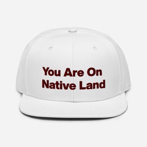 You Are On Native Land Maroon Script Snapback Hat