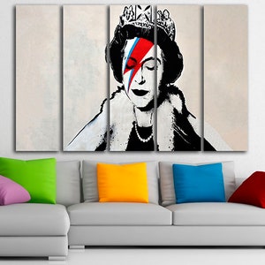 May include: A four-panel canvas print featuring a black and white portrait of Queen Elizabeth II with a red, blue, and white lightning bolt painted over her right eye. The background is a light beige color.