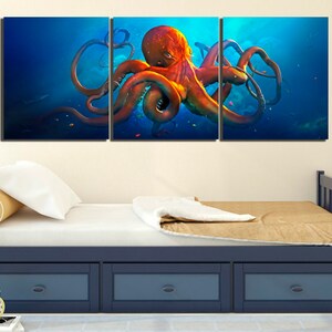 May include: A three-piece canvas wall art set featuring a vibrant orange octopus with tentacles outstretched against a deep blue ocean background.