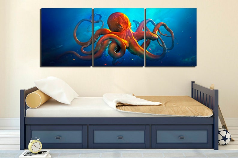 May include: A three-piece canvas wall art set featuring a vibrant orange octopus with tentacles outstretched against a deep blue ocean background.
