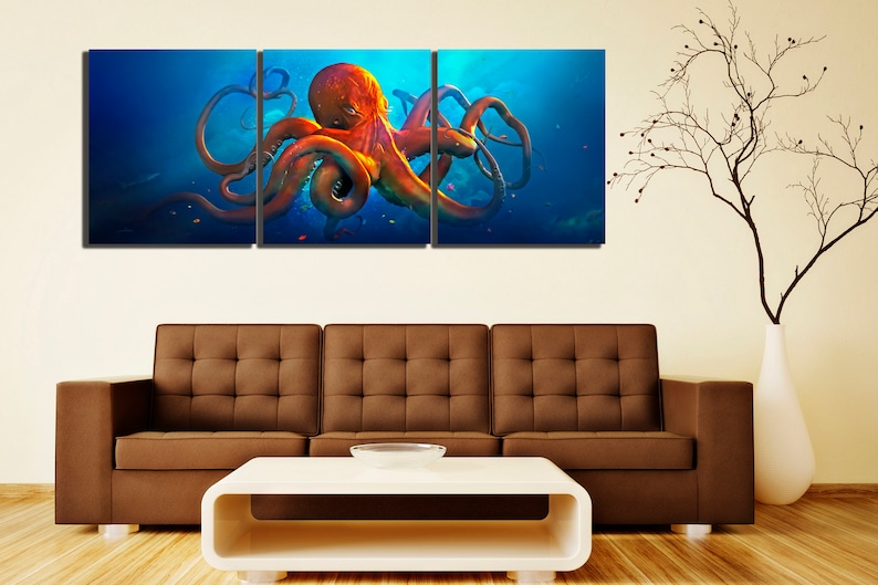 May include: A three-piece canvas wall art set featuring a vibrant orange octopus with tentacles outstretched against a blue ocean background.