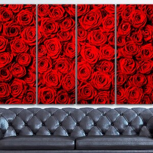 May include: A close-up of a wall art print featuring a red rose pattern. The print is divided into four panels, each showing a different section of the rose pattern.