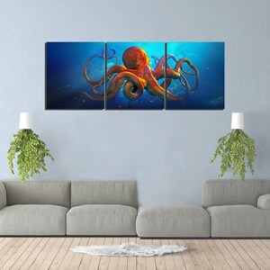 May include: A three-panel canvas print featuring a vibrant orange octopus with tentacles outstretched against a blue background. The octopus appears to be swimming in the ocean.