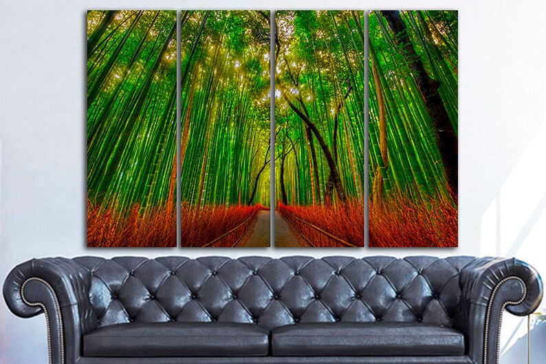 May include: A multi-panel canvas print depicting a path through a lush green bamboo forest. The path is lined with tall, slender bamboo stalks, and the sunlight filters through the leaves, creating a dappled effect. The forest floor is covered in a layer of red and orange leaves.