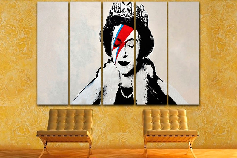May include: A multi-panel canvas print featuring a black and white portrait of Queen Elizabeth II with a red, blue, and white lightning bolt painted over her right eye. The queen is wearing a crown and a fur collar.
