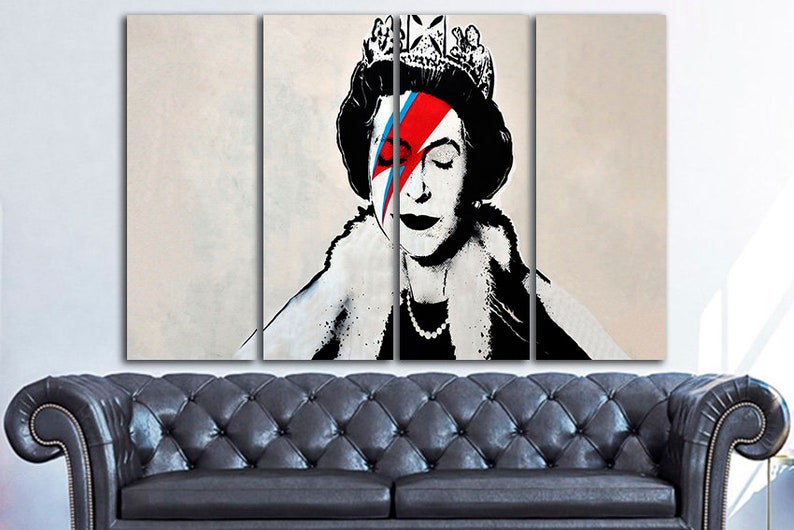 May include: A three-panel canvas print featuring a black and white portrait of Queen Elizabeth II with a red, blue, and white lightning bolt painted over her right eye. The queen is wearing a crown and a fur collar.