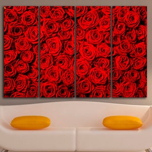 May include: A close-up image of a wall art print featuring a red rose pattern. The print is divided into four panels, each showing a different section of the rose pattern.
