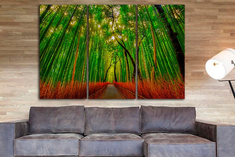 May include: A three-panel canvas print depicting a path through a lush green bamboo forest. The path is lined with tall, slender bamboo stalks, and the sunlight filters through the leaves, creating a dappled effect.