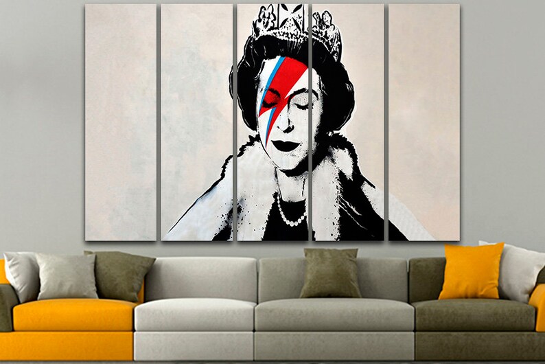 May include: A multi-panel canvas print featuring a black and white portrait of Queen Elizabeth II with a red, blue, and white lightning bolt painted across her face, reminiscent of David Bowie's iconic makeup.