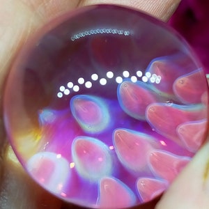 Anenome marble, handmade from Borosilicate Glass. Has lovely translucent blue effects.