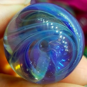 Chaos marble handmade from Borosilicate Glass, with tones of lovely blue lusters!