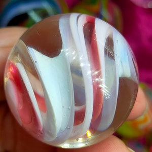 Handmade marble, made with Borosilicate Glass, beautiful rich gold-based pink and milky white colours.