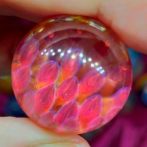 Anenome marble, handmade from Borosilicate Glass. Has lovely translucent pinks, purples and blues.