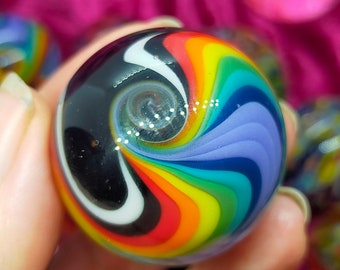 Rainbow glass marble with sparkles, handmade from borosilicate glass