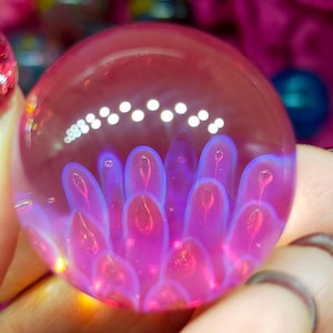 Anenome marble, handmade from Borosilicate Glass. Has lovely translucent pinks, purples and blues.