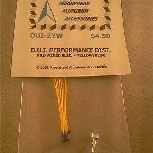 May include: A yellow and blue pre-wired electronic distributor for a car, labeled "D.U.I. Performance Dist. Pre-Wired Elec. - Yellow/Blue" and "DUI-2YW" with a price tag of $4.50. The product is packaged in a clear plastic bag with a brown paper header card that reads "Arrowhead Aluminum Accessories".