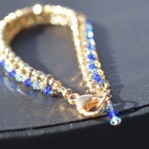 Gold and blue tennis bracelet