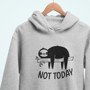 May include: A gray hoodie with a black sloth hanging from a branch and the text "NOT TODAY".