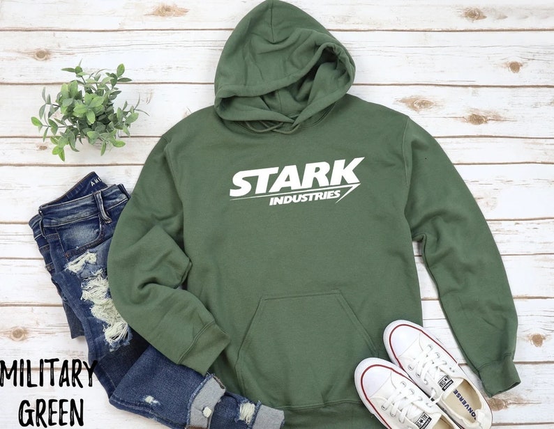 May include: A green hooded sweatshirt with the words "Stark Industries" printed in white on the front.