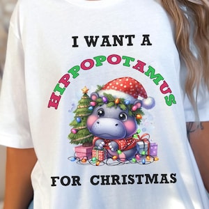 Camiseta engraçada de hipopótamo de Natal, camiseta de feriado de hipopótamo, presente engraçado de Natal, hipopótamo fofo de Natal, Moo Deng, presente para amantes de hipopótamos, camiseta para amantes de animais
