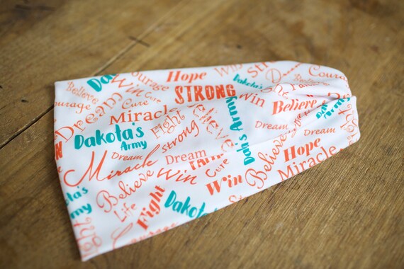 Dakota's Army Charity Fundraiser - Orange and Turquoise words - Women's Knit Stretch Headband - Childhood Leukemia Cancer Awareness