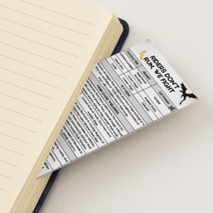May include: A black and white printable character sheet for a role-playing game. The sheet includes sections for character name, race, class, and stats. The title of the sheet is "Riders Don't Run, We Fight".