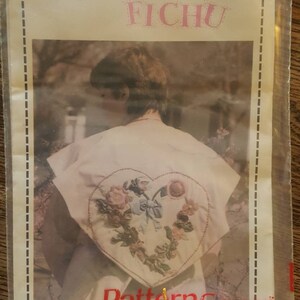 May include: A vintage craft pattern for a "Fantastic Fichu" with a heart-shaped floral embroidery design. The pattern is from Pattern Saver, Fran Gallipp, Schulenburg, Texas 78956.