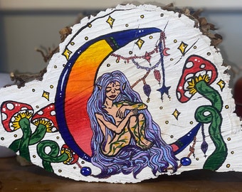 Whimsical fairy painted log, beautiful fairy sat on the moon