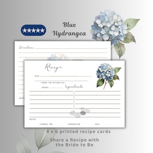 May include: White recipe cards with a blue hydrangea floral design. The cards are 10 x 15 cm and feature lines for directions, ingredients, and notes. Text on the cards reads "Recipe" and "Share a Recipe with the Bride to Be."
