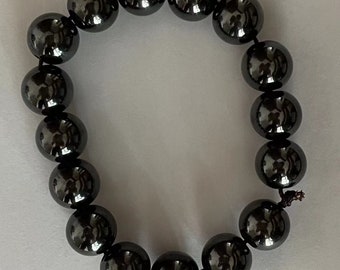 bracelet of black Titanium, 18 beads of 12mm diameter and 3.5mm hole